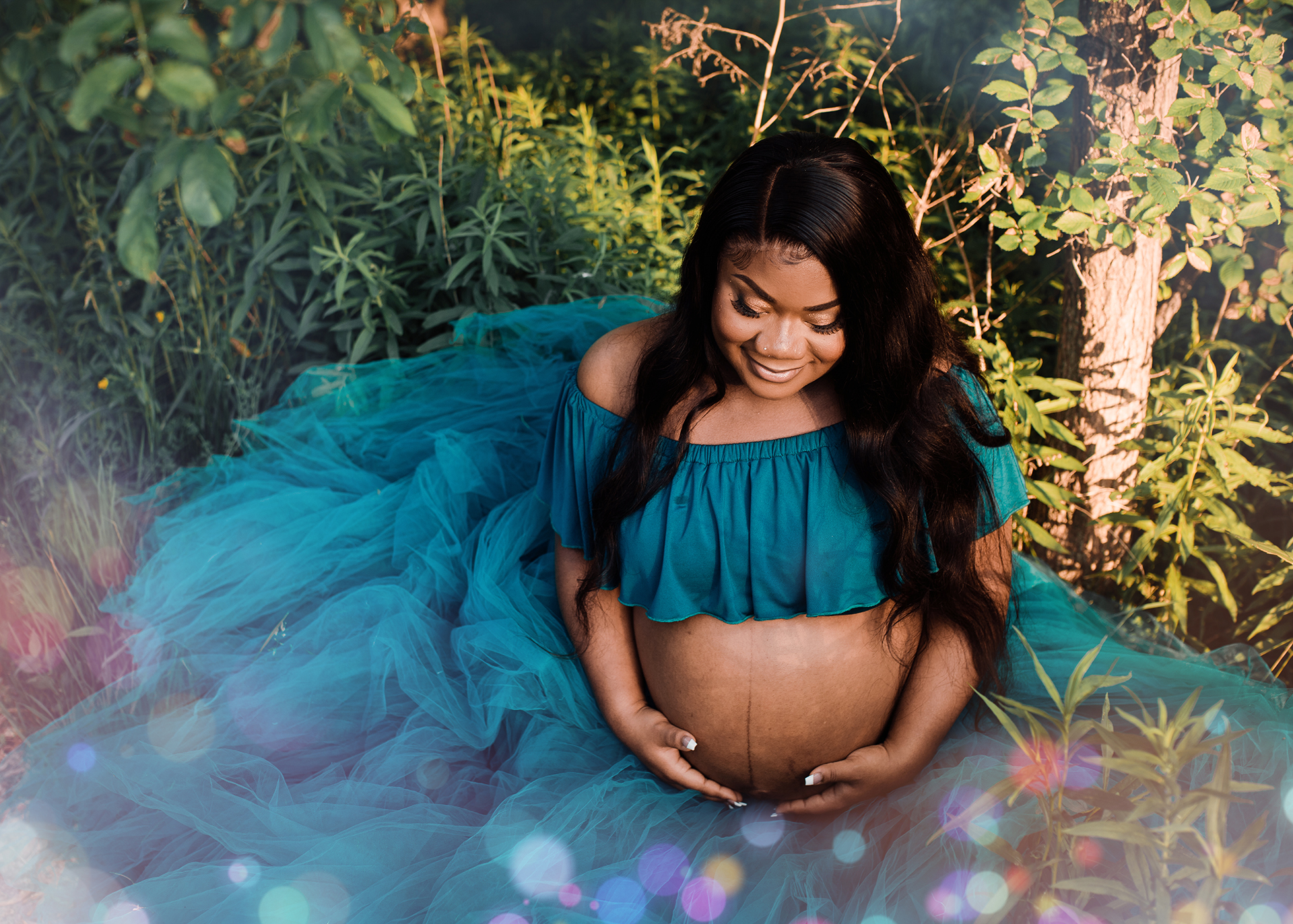bare belly maternity in tulle skirt and greenery in minneapolis mn