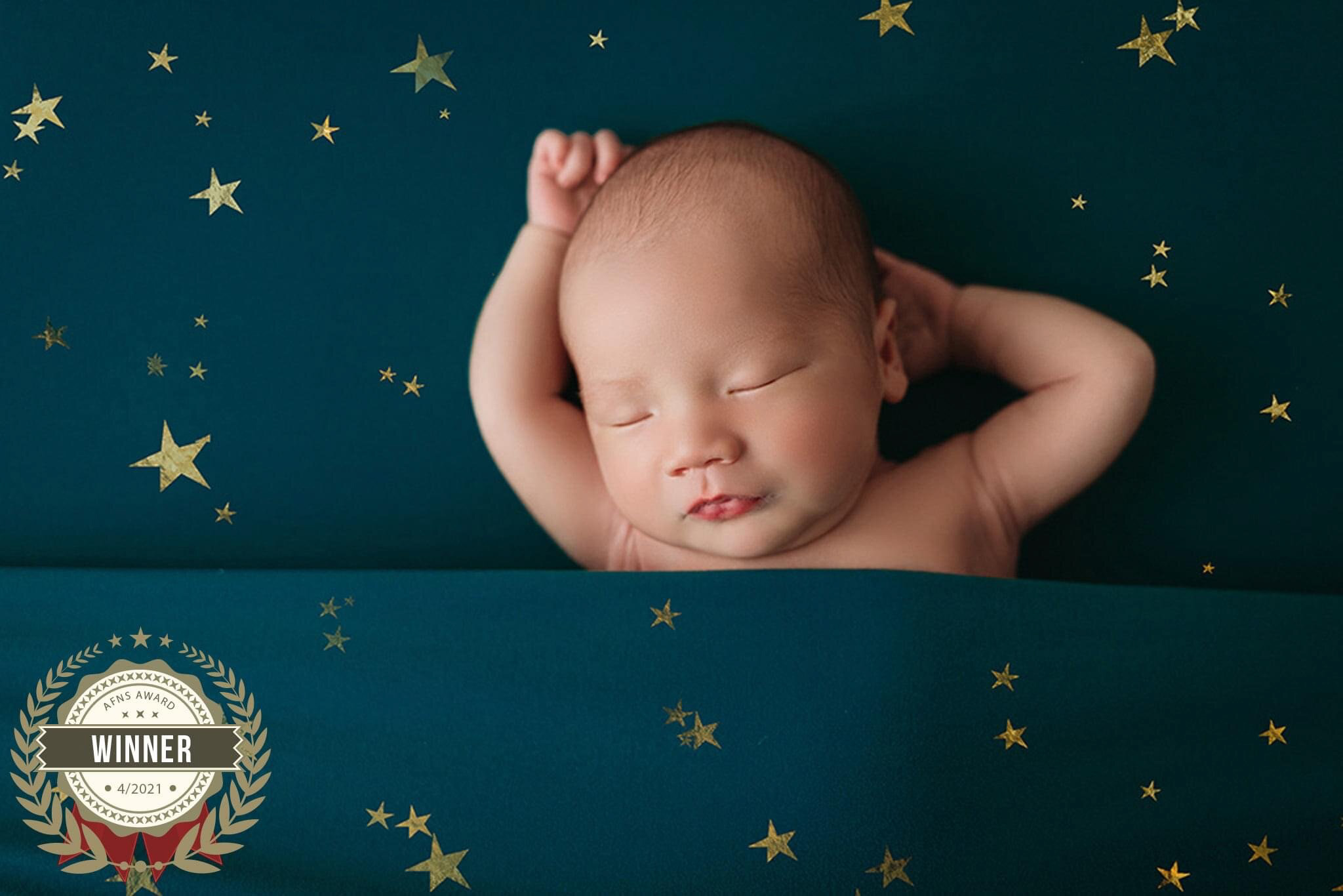 baby boy on star fabric background in minneapolis newborn session