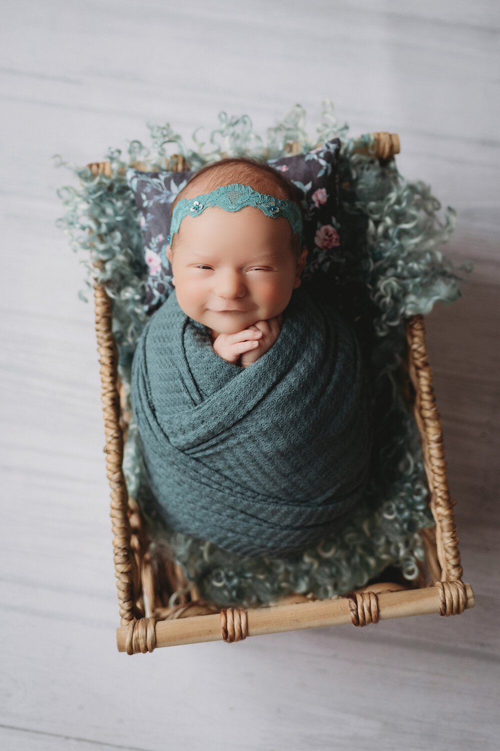 potato pose in teal with baby girl for newborn photography session in minneapolis mn